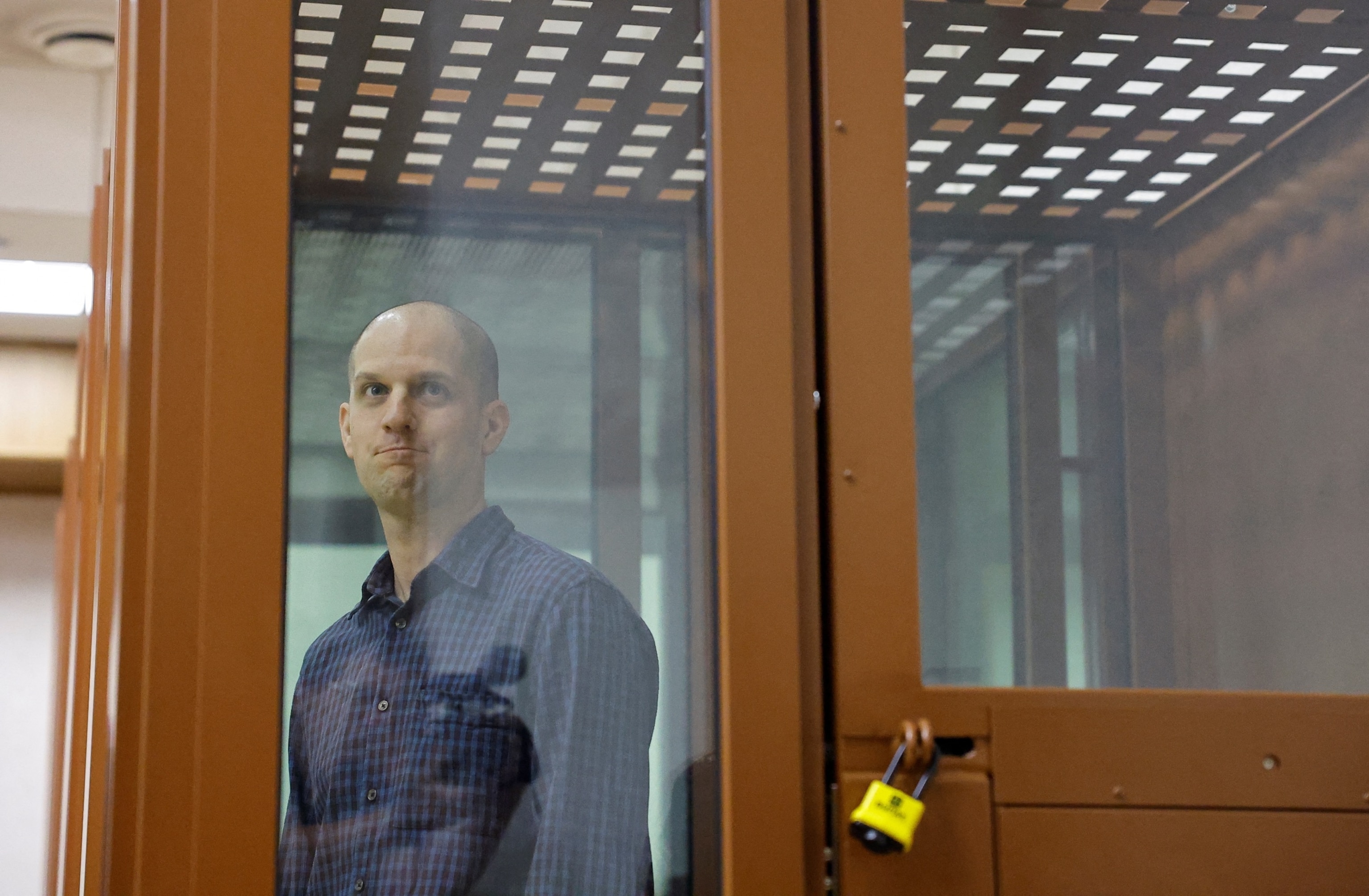 PHOTO: Wall Street Journal reporter Evan Gershkovich, who stands trial on spying charges, is seen inside an enclosure for defendants before a court hearing in Yekaterinburg, Russia June 26, 2024.