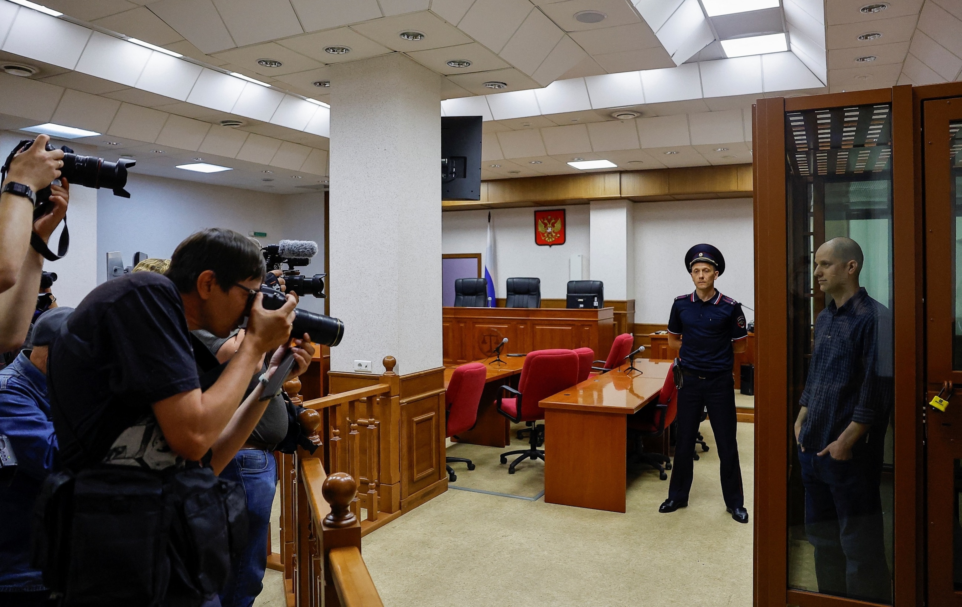 PHOTO: Wall Street Journal reporter Evan Gershkovich, who stands trial on spying charges, is seen inside an enclosure for defendants before a court hearing in Yekaterinburg, Russia June 26, 2024. 