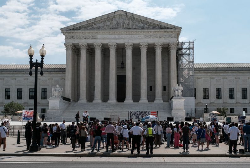 WASHINGTON, DC - JUNE 28: Demonstrators gather outside of the U.S. Supreme Court as opinions were issued on June 28, 2024 in Washington, D.C. The Supreme Court on Friday ruled in favor of a former police officer who is seeking to throw out an obstruction charge for joining the Capitol riot on Jan 6, 2021. (Photo by Michael A. McCoy/Getty Images)