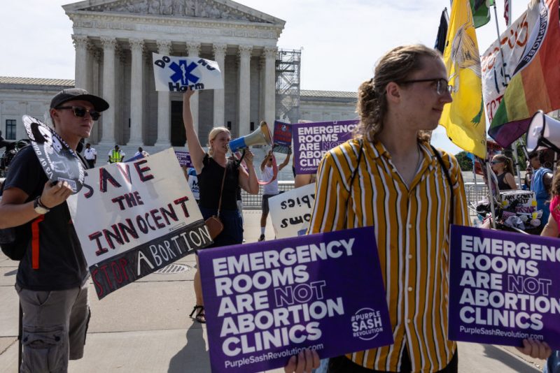 WASHINGTON, DC - JUNE 26: Anti-abortion demonstrators gather in front of the Supreme Court on June 26, 2024 in Washington, DC. A ruling is expected this week in the case of Moyle v. United States, which will determine if hospitals in states with abortion bans will be required by law to provide abortion procedures in emergency situations. (Photo by Anna Rose Layden/Getty Images)