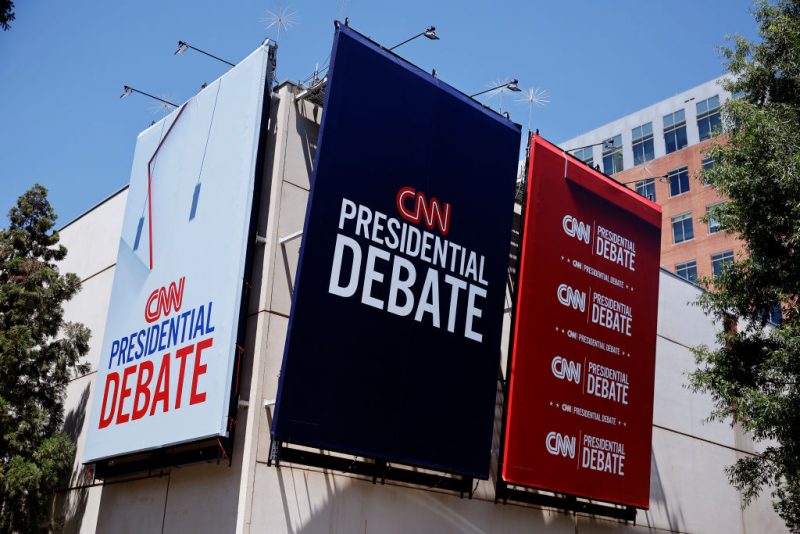 ATLANTA, GEORGIA - JUNE 25: Signs advertising the presidential debate hosted by CNN are seen outside of their studios on June 25, 2024 in Atlanta, Georgia. U.S. President Joe Biden and Republican presidential candidate former President Donald Trump will face off in the first presidential debate of the 2024 presidential cycle this Thursday. (Photo by Kevin Dietsch/Getty Images)