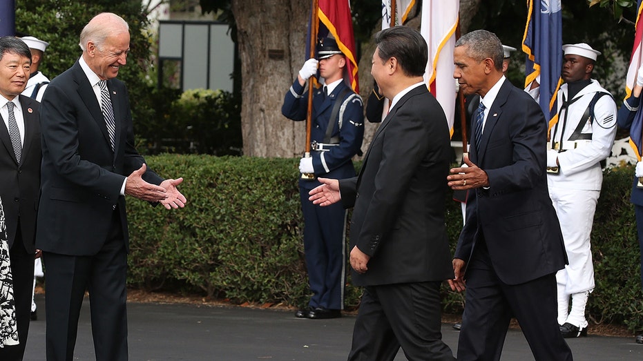 Vice President Biden reaches to shake hands with Chinese president Xi Jinping (center), as former President Obama stands nearby during arrival ceremony at the White House on Sept. 25, 2015. 