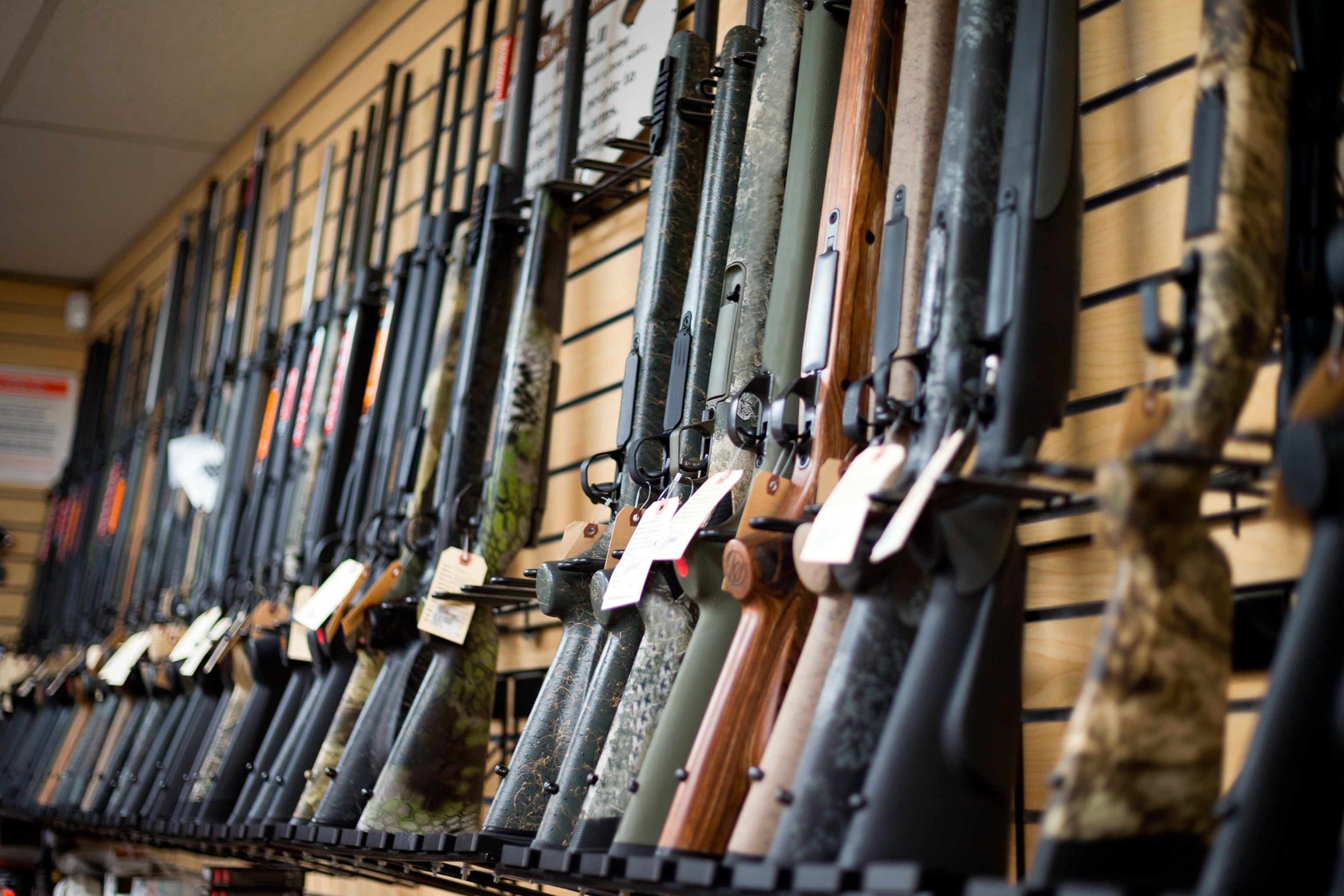 PHOTO: A rifle gun display is seen on the wall of a gun shop in Colorado.
