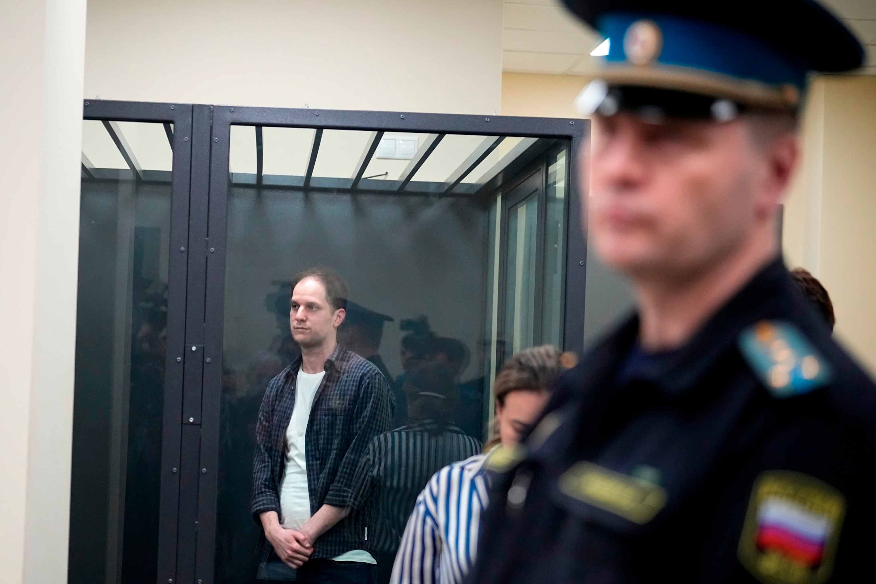 PHOTO: Wall Street Journal reporter Evan Gershkovich, left, stands in a glass cage in a courtroom at the First Appeals Court of General Jurisdiction in Moscow, Russia, Tuesday, April 23, 2024.