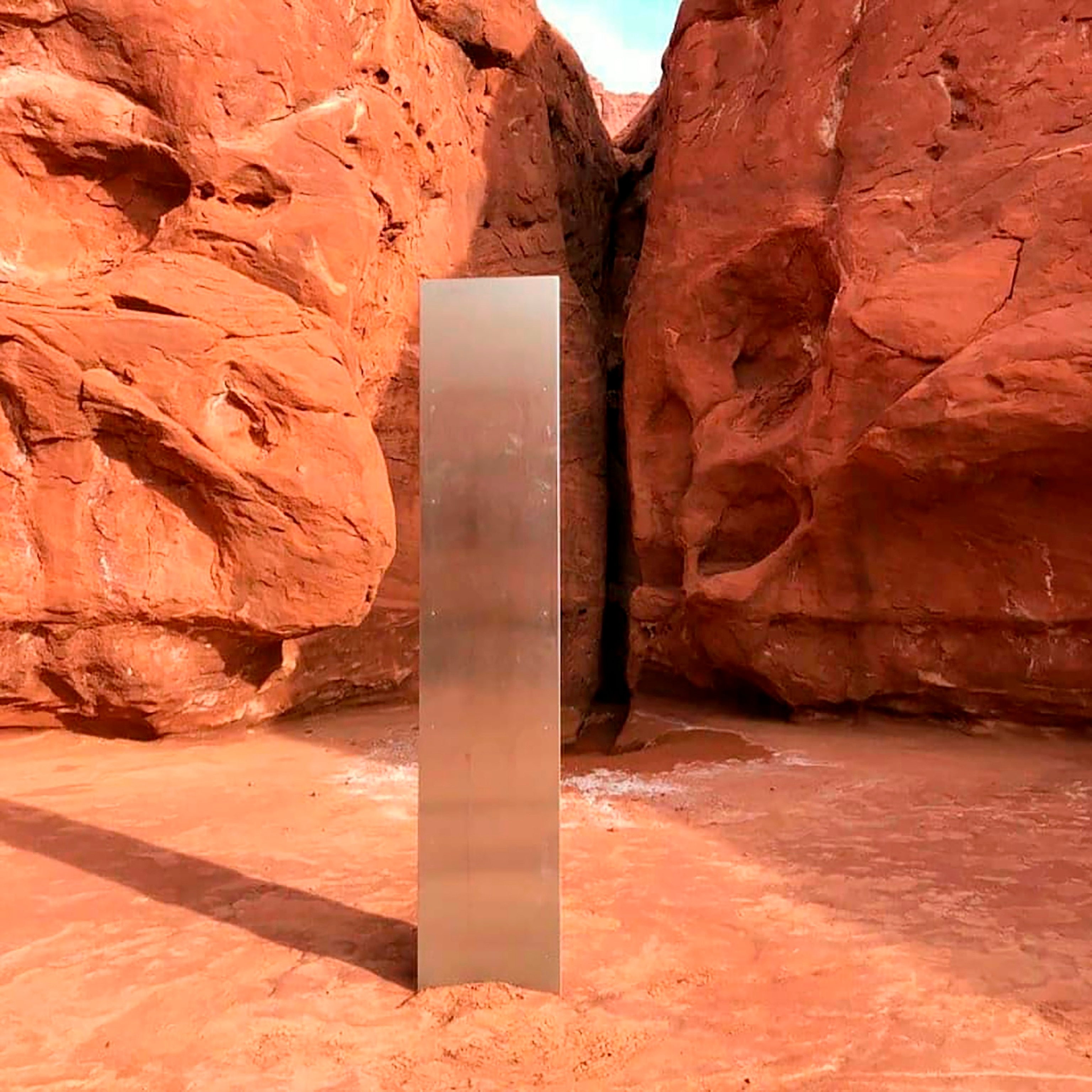 PHOTO: This Nov. 18, 2020, file photo provided by the Utah Department of Public Safety shows a metal monolith in the ground in a remote area of red rock in Utah.