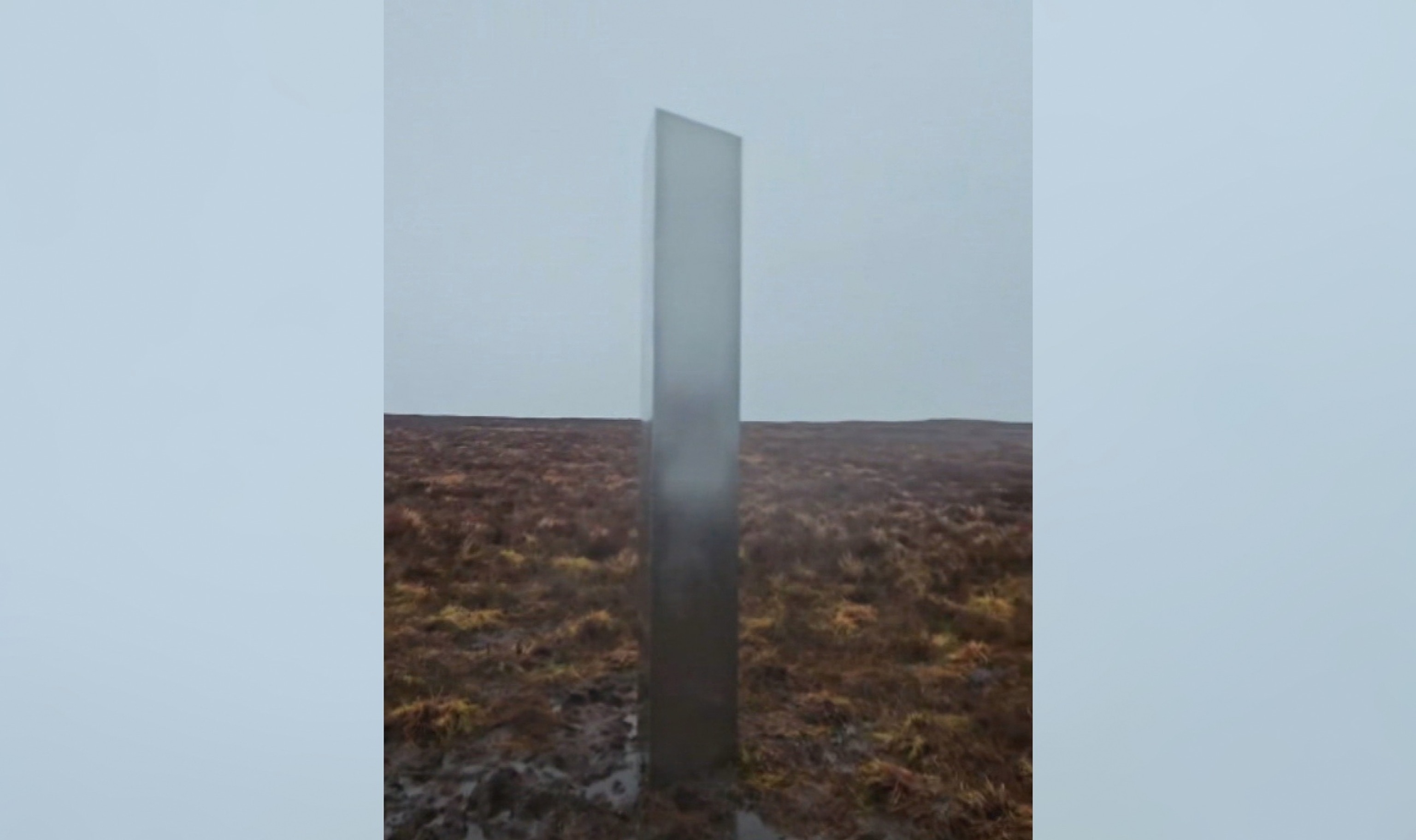 PHOTO: A mysterious, roughly 10-foot-tall silver metal monolith was discovered on a muddy bluff in Wales by hiker Craig Muir.