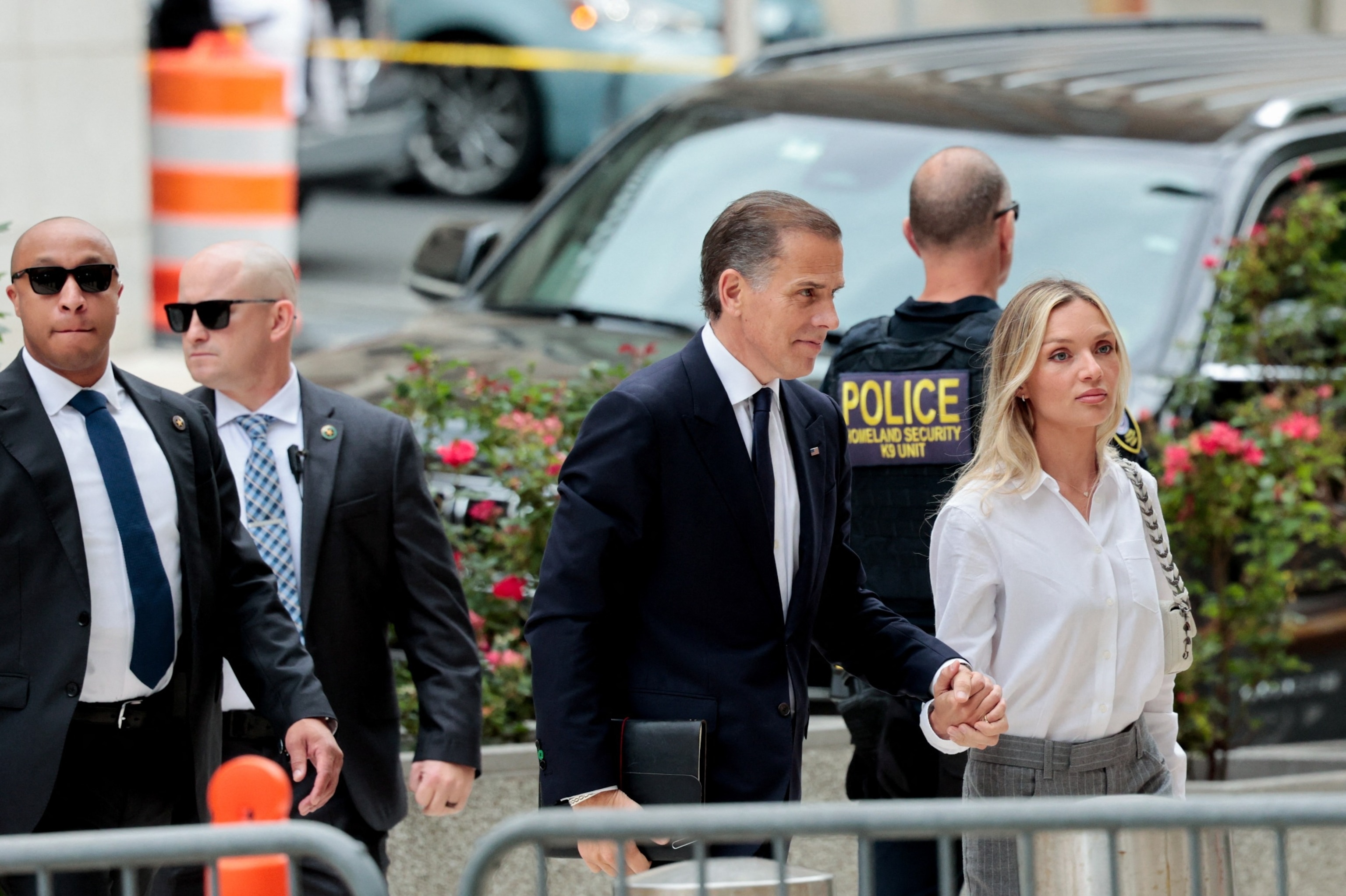 PHOTO: Hunter Biden, son of President Joe Biden, and his wife Melissa Cohen Biden walk outside the federal court as his trial on criminal gun charges continues, in Wilmington, Del., June 11, 2024.