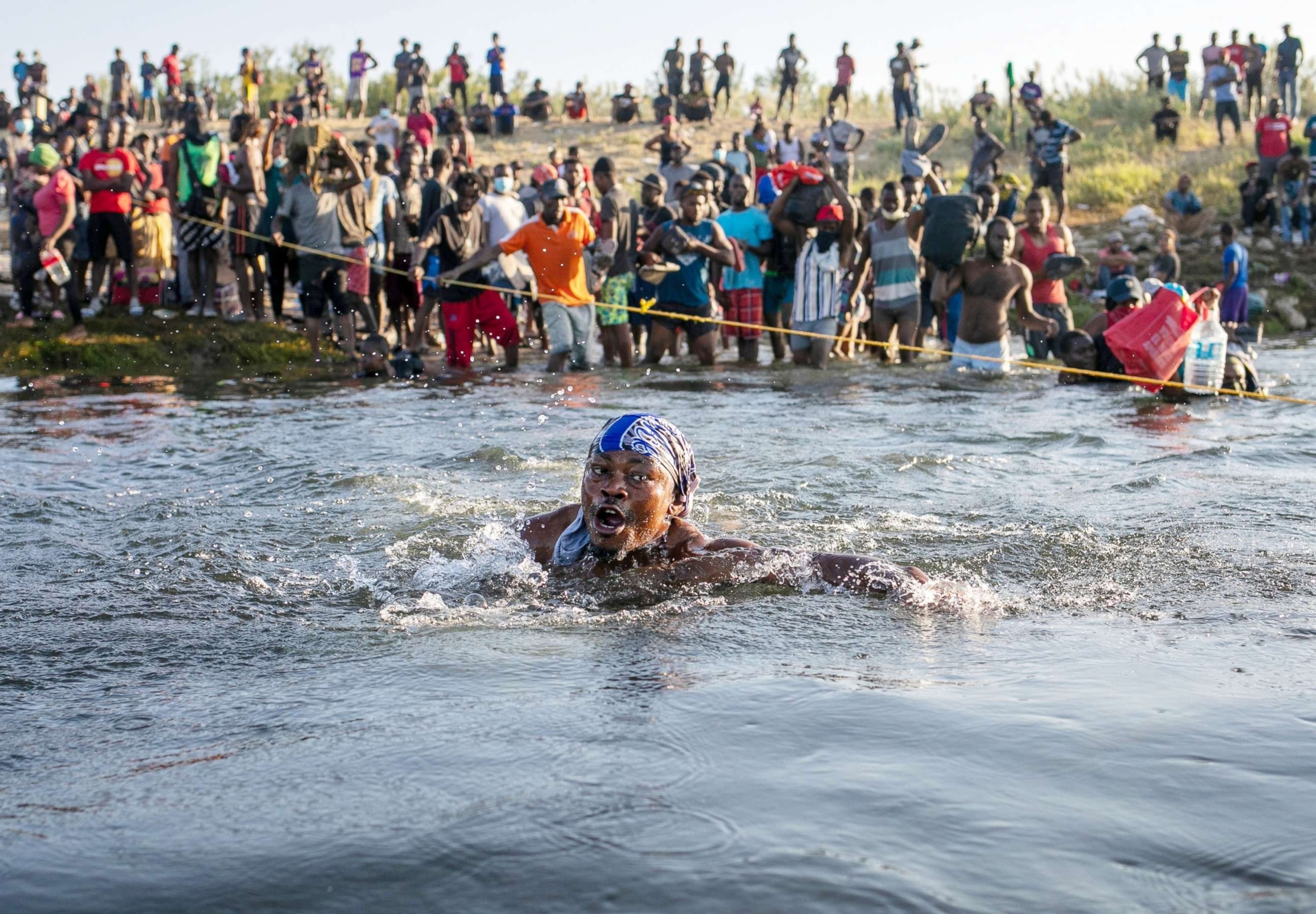 PHOTO: Haitian immigrants cross the Rio Grande back into Mexico from Del Rio, Texas to Ciudad Acuna, Mexico. Sept. 20, 2021