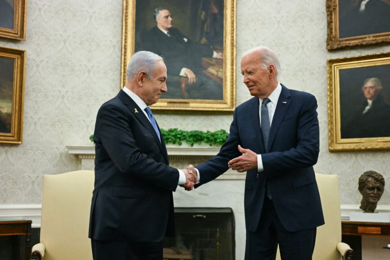 TOPSHOT - US President Joe Biden (R) shakes hands with Israeli Prime Minister Benjamin Netanyahu during a meeting in the Oval Office of the White House in Washington, DC, on July 25, 2024. (Photo by Jim WATSON / AFP) (Photo by JIM WATSON/AFP via Getty Images)