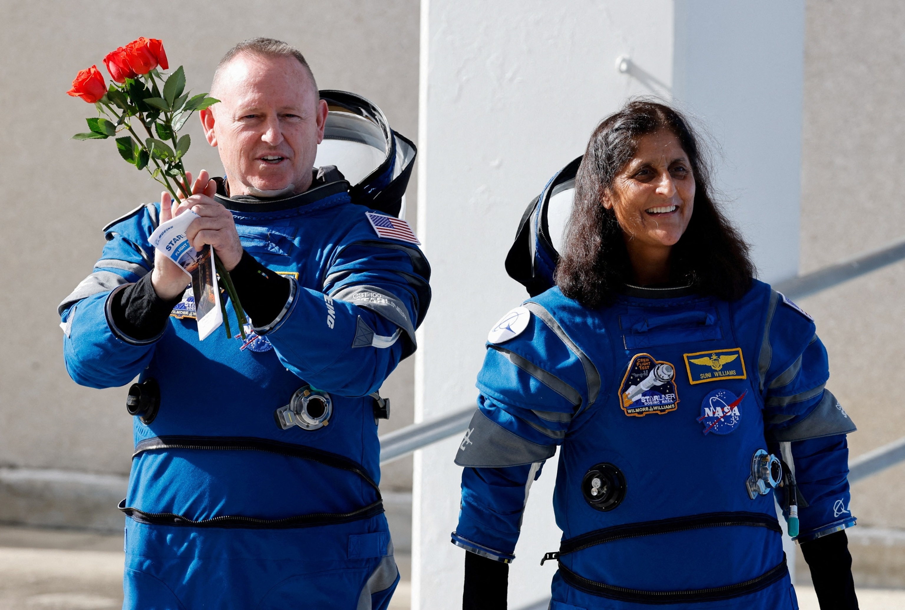PHOTO: NASA astronauts Butch Wilmore and Suni Williams walk at NASA's Kennedy Space Center, on the day of Boeing's Starliner-1 Crew Flight Test (CFT) mission, in Cape Canaveral, Florida, on June 1, 2024. 