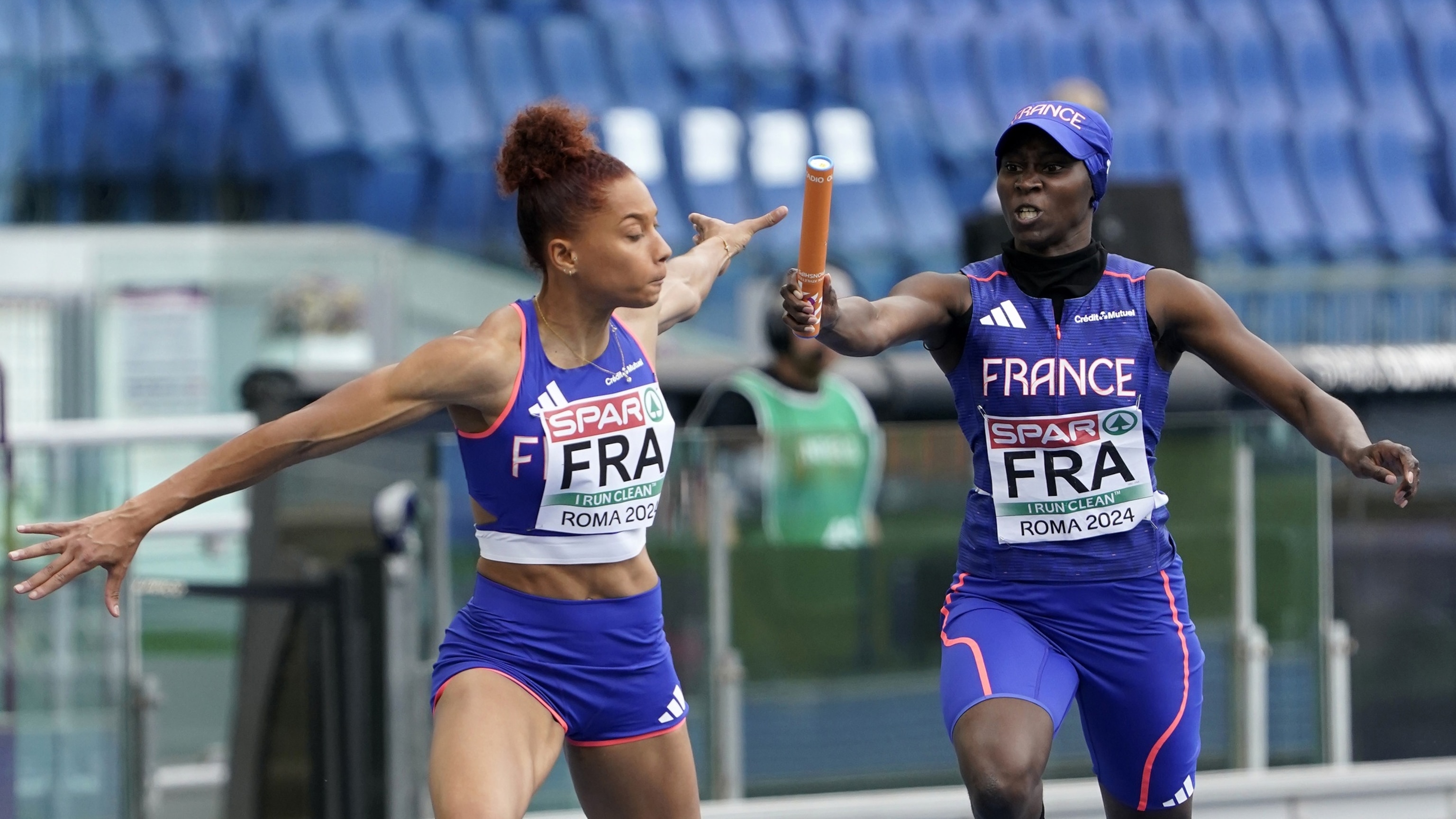PHOTO: Sylla Sounkamba of team France handing her baton to Alexe Deau of the team France competing o 4 x 400m Relay Women during day five of the 26th European Athletics Championships - Rome 2024, June 11, 2024, in Rome.
