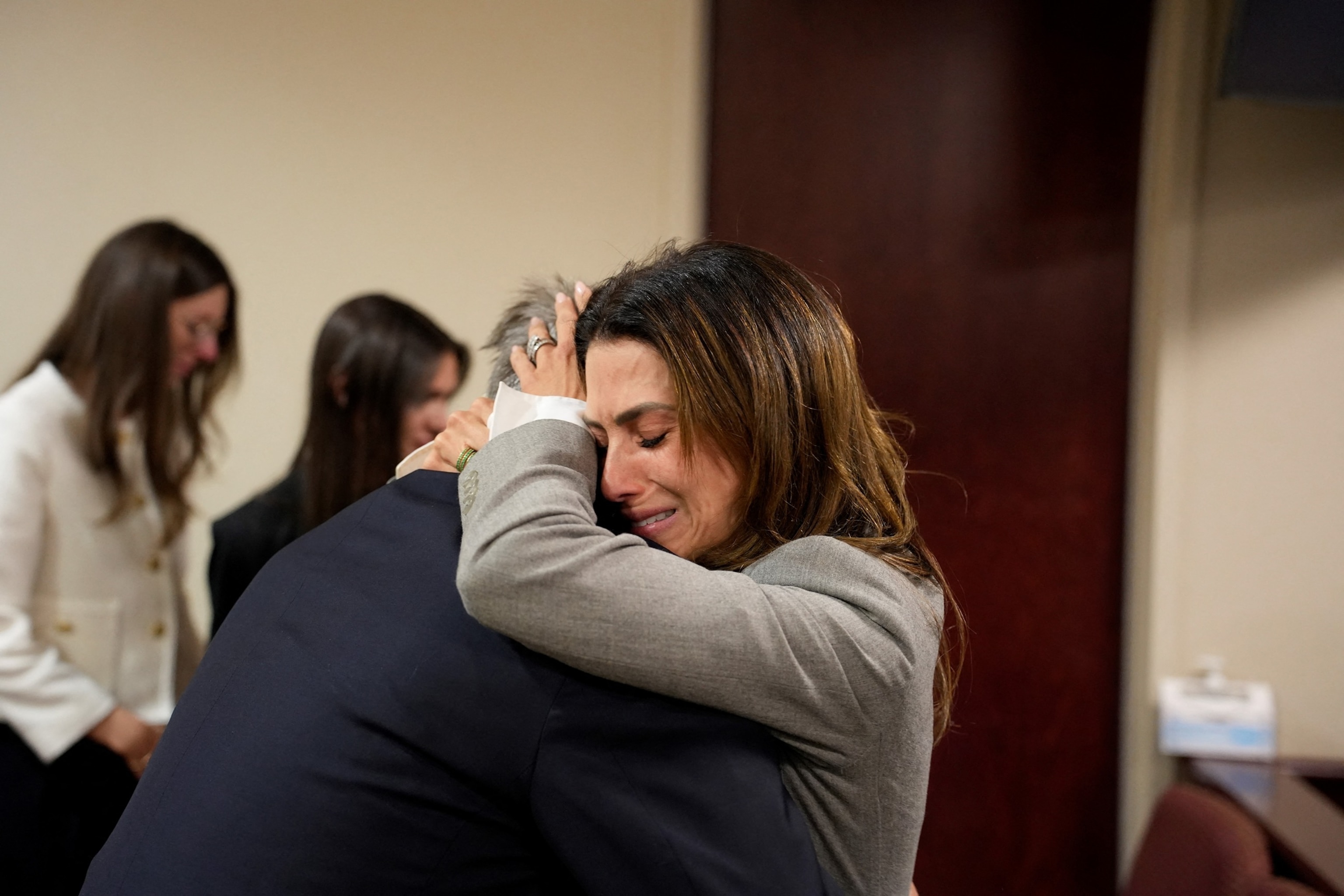 PHOTO: Alec Baldwin and his wife Hilaria Baldwin embrace during his trial on involuntary manslaughter at Santa Fe County District Court in Santa Fe, New Mexico, on July 12, 2024. 