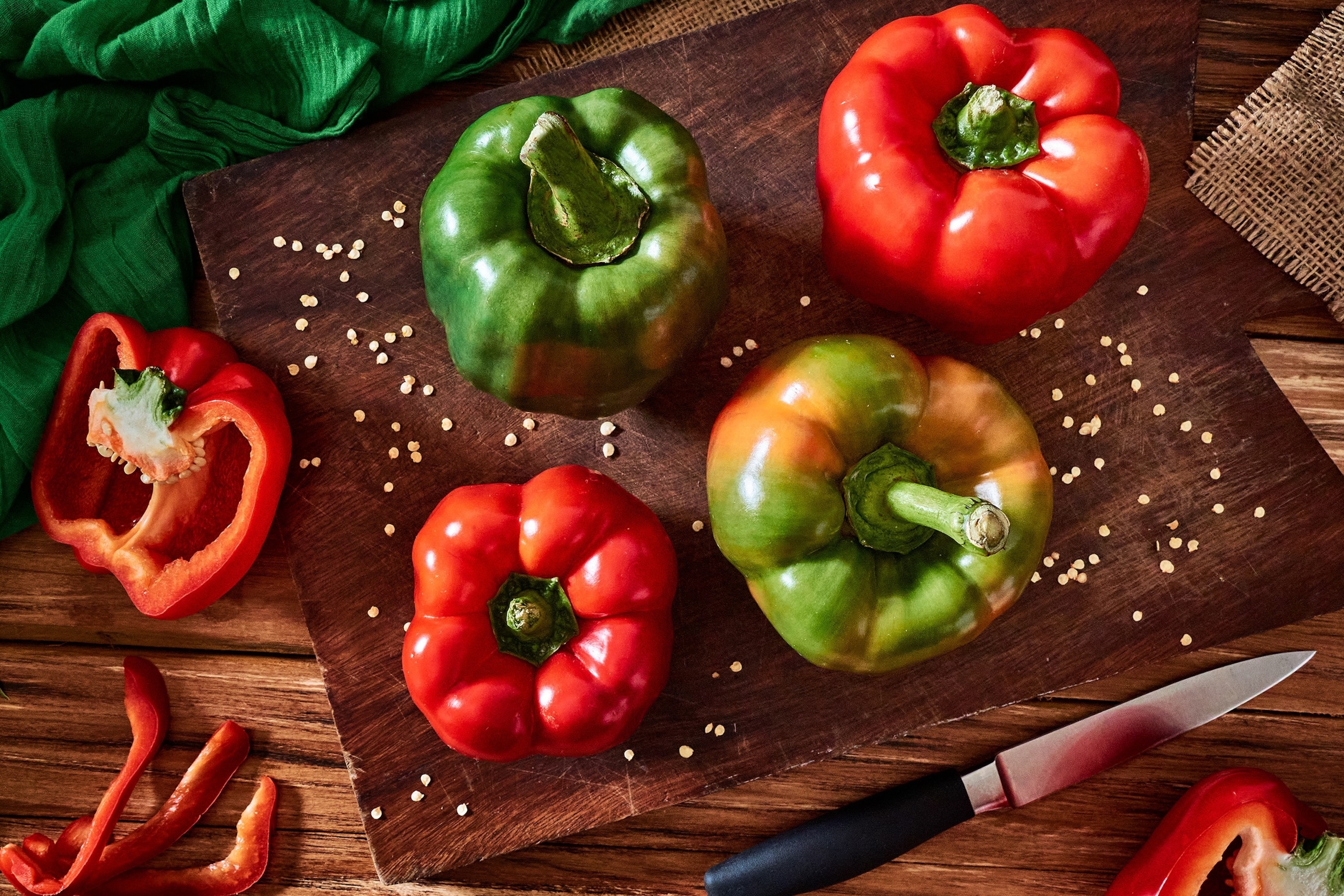 PHOTO: Fresh red and green sweet pepper on a cutting board