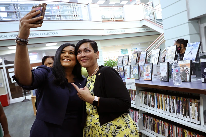 ALEXANDRIA, VIRGINIA - JULY 16: Texas State Rep. Shawn Thierry (D-146) (L) takes a photo with Hala Ayala, Democratic nominee for Virginia lieutenant governor, as they visit the Kate Waller Barrett Branch Library, the site of the 1939 Alexandria Library sit-in, where five Black men were arrested for attempting to register for a library card, on July 16, 2021 in Alexandria, Virginia. Members of Texas House Democratic Caucus continue to lobby for voting rights reform in Washington, DC after leaving Texas to block a voting restrictions bill by denying a Republican quorum. (Photo by Kevin Dietsch/Getty Images)