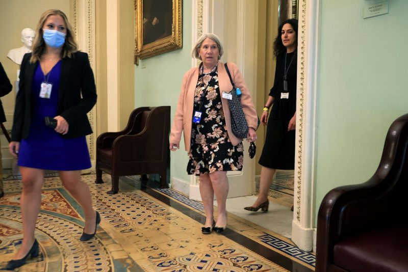 WASHINGTON, DC - JULY 22: Anita Dunn (C), senior advisor to President Joe Biden, and White House Deputy Director of Legislative Affairs Reema Dodin (R) arrive for a lunch meeting with Senate Democrats at the U.S. Capitol on July 22, 2021 in Washington, DC. Dunn and Dodin are meeting with the senators to to help them push back against Republican accusations that the president's Build Back Better agenda is reckless spending. She suggested Democrats highlight the budget's 'child tax credits, lower prescription drug costs, universal pre-school' and as a tax cut for middle class families. (Photo by Chip Somodevilla/Getty Images)