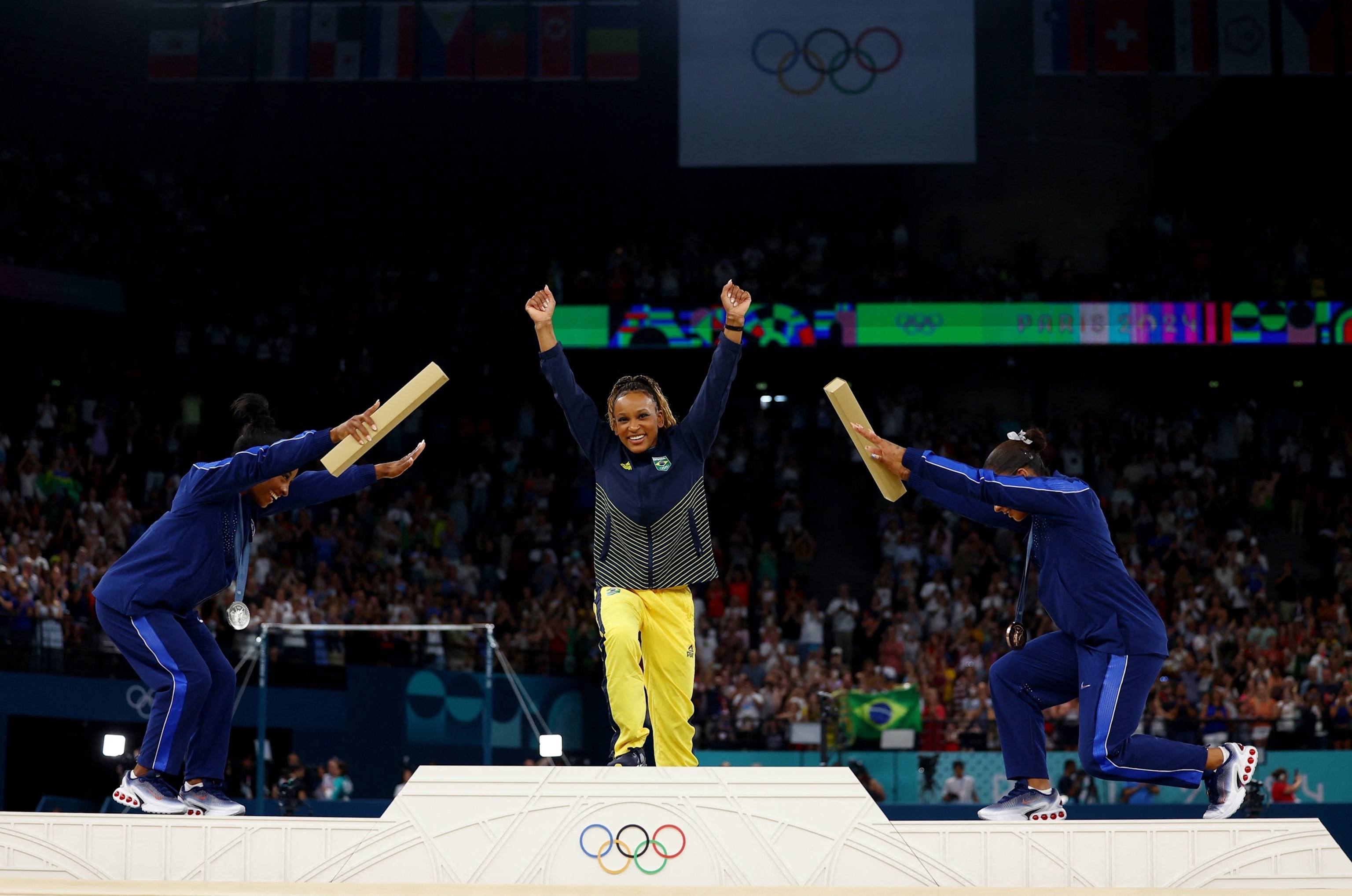 PHOTO: Silver medalist Simone Biles and bronze medalist Jordan Chiles of the U.S. bow to gold medalist Rebeca Andrade of Brazil following the women's artistic gymnastics individual floor exercise final at the 2024 Paris Olympics, Aug. 5, 2024.