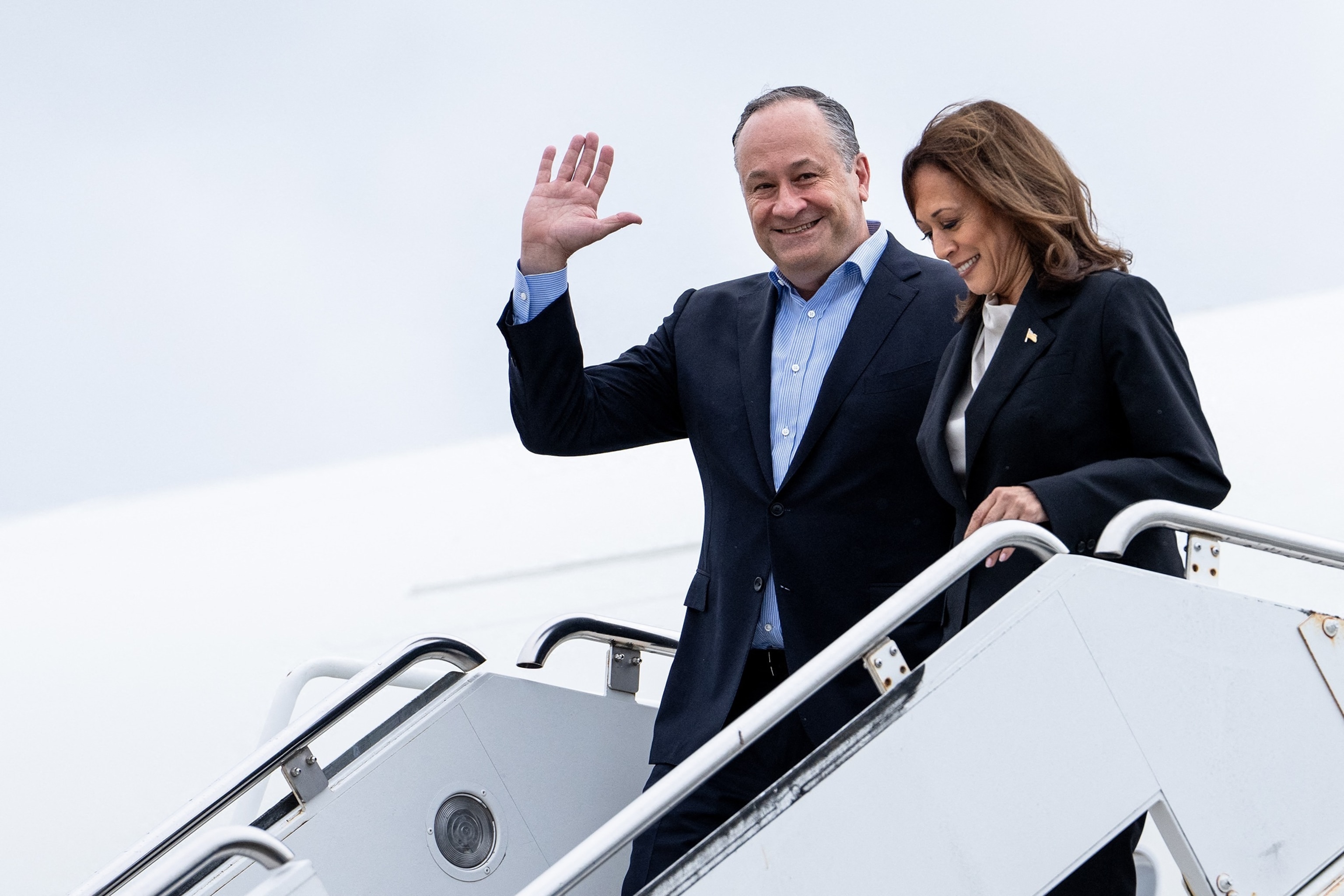 PHOTO: Vice President Kamala Harris and second gentleman Douglas Emhoff descend from Air Force Two at Delaware National Air Guard base in New Castle, Del., on July 22, 2024.