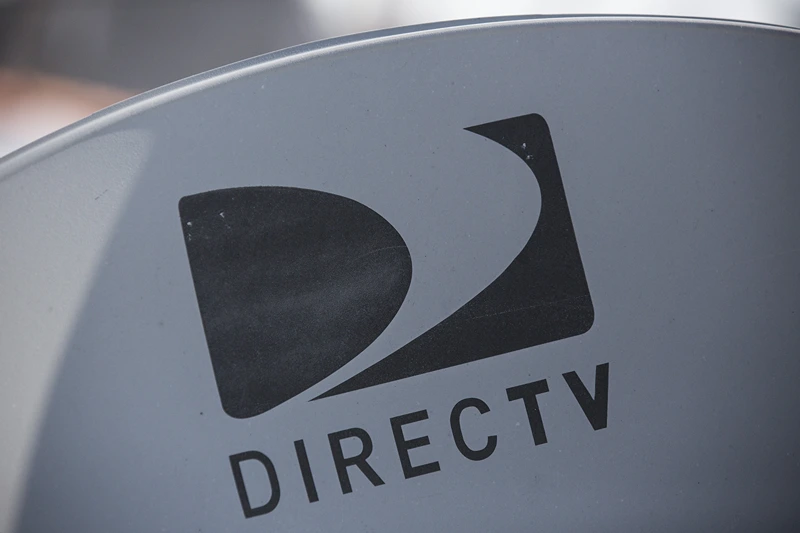 A DirecTV sattelite dish sits on a roof on May 19, 2014 in New York City. AT&T agreed May 18, to buy DirecTV for $48.5 billion. (Photo by Andrew Burton/Getty Images)