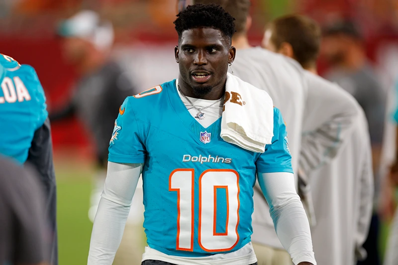 Tyreek Hill #10 of the Miami Dolphins looks on during a preseason game against the Tampa Bay Buccaneers at Raymond James Stadium on August 23, 2024 in Tampa, Florida. (Photo by Mike Ehrmann/Getty Images)