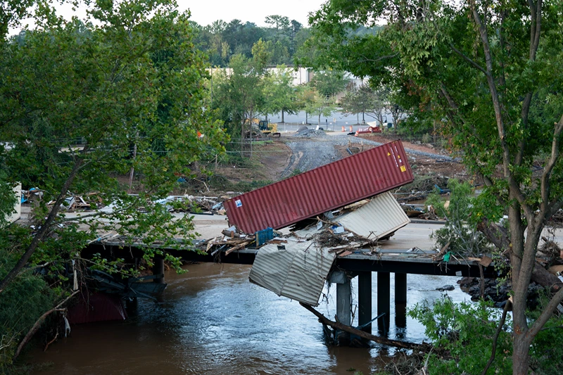 ASHEVILLE, NORTH CAROLINA - SEPTEMBER 29: Flood damage is strewn across a road in the aftermath of Hurricane Helene on September 29, 2024 in Asheville, North Carolina. According to reports, more than 60 people have been killed across the South due to the storm, and millions have been left without power. North Carolina has been approved for a Federal Major Disaster Declaration. (Photo by Sean Rayford/Getty Images)