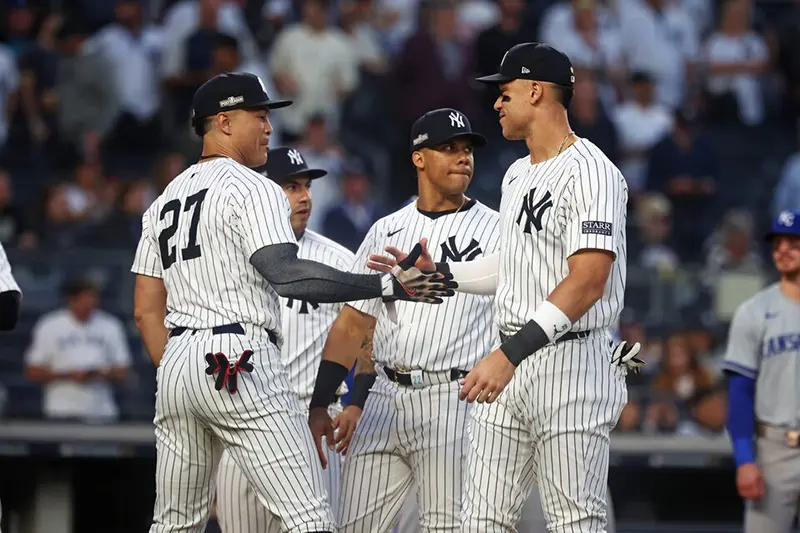 New York Yankees designated hitter Giancarlo Stanton (27) and New York Yankees outfielder Aaron Judge (99) warms up before the game during game one of the ALDS for the 2024 MLB Playoffs at Yankee Stadium. Mandatory Credit: Vincent Carchietta-Imagn Images