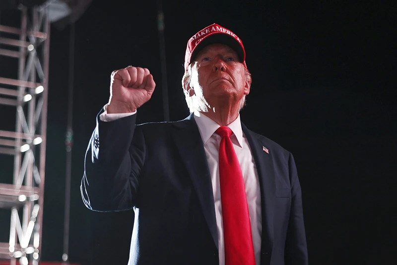 Republican presidential nominee, former U.S. President Donald Trump gestures as he walks offstage after speaking at a campaign rally on October 12, 2024 in Coachella, California. With 24 days to go until election day, former President Donald Trump is detouring from swing states to hold the rally in Democratic presidential nominee, Vice President Kamala Harris' home state. (Photo by Mario Tama/Getty Images)