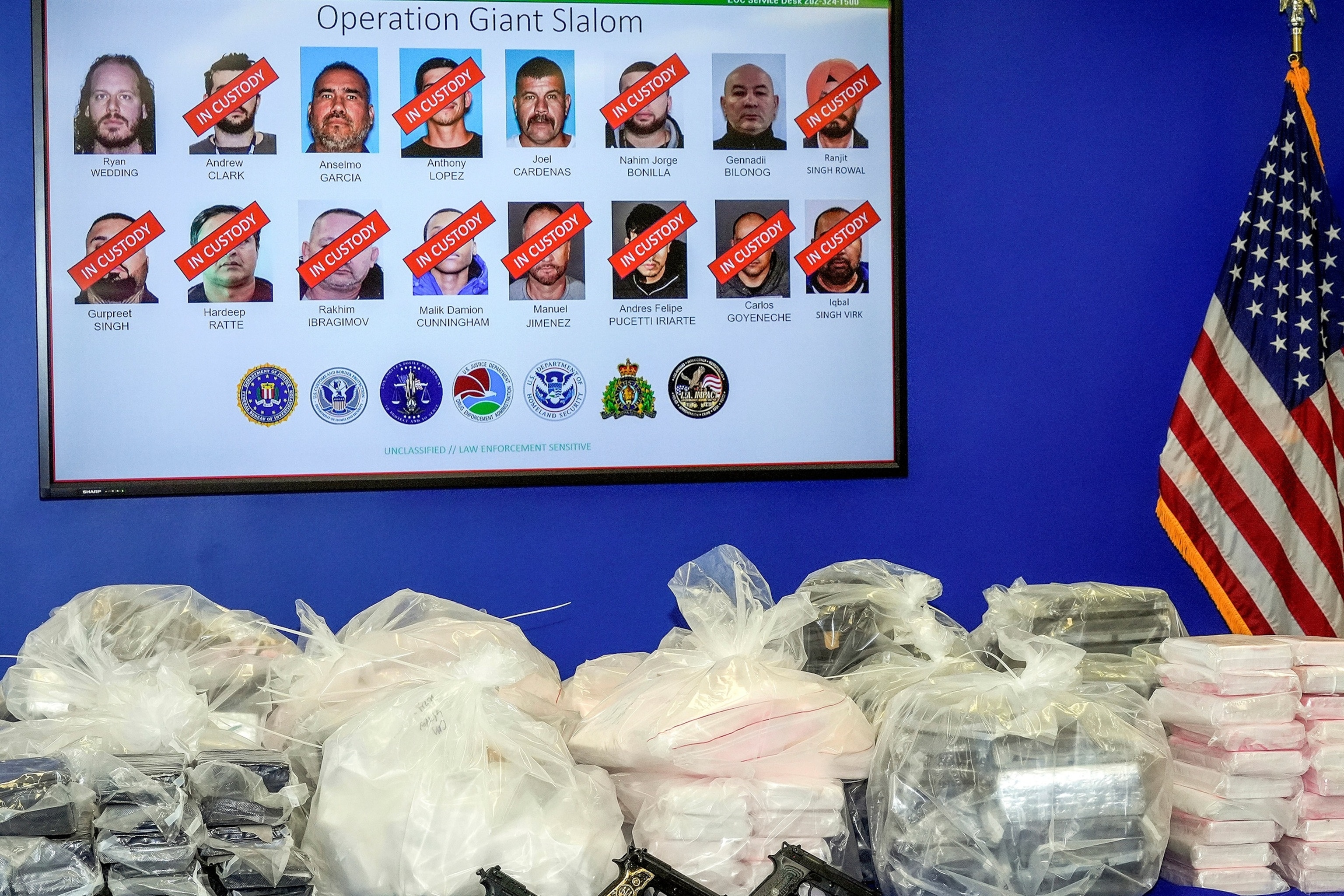 PHOTO: Canadian former Olympic snowboarder Ryan Wedding, 43, who is a fugitive, is seen top left, with 15 other defendants who have been charged in a transnational drug trafficking operation, are displayed in Los Angeles, Oct. 17, 2024.