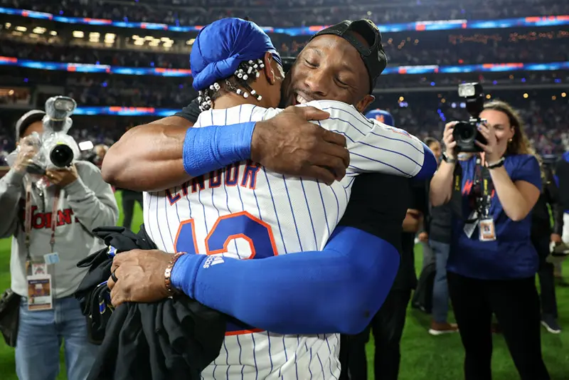 Francisco Lindor #12 and Starling Marte #6 of the New York Mets celebrate after beating the Philadelphia Phillies 4-1 in Game Four of the Division Series at Citi Field on October 09, 2024 in New York City. (Photo by Elsa/Getty Images)