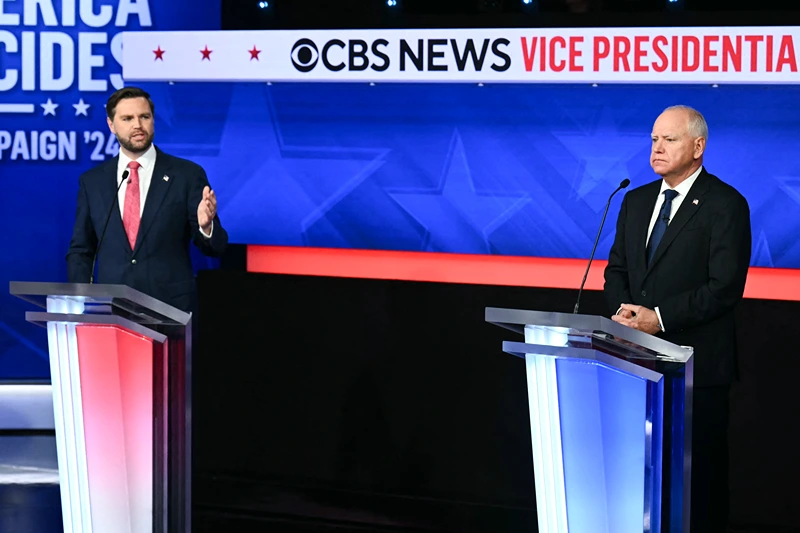 US Senator and Republican vice presidential candidate J.D. Vance (L) and Minnesota Governor and Democratic vice presidential candidate Tim Walz participate in the Vice Presidential debate hosted by CBS News at the CBS Broadcast Center in New York City on October 1, 2024. (Photo by ANGELA WEISS / AFP) (Photo by ANGELA WEISS/AFP via Getty Images)