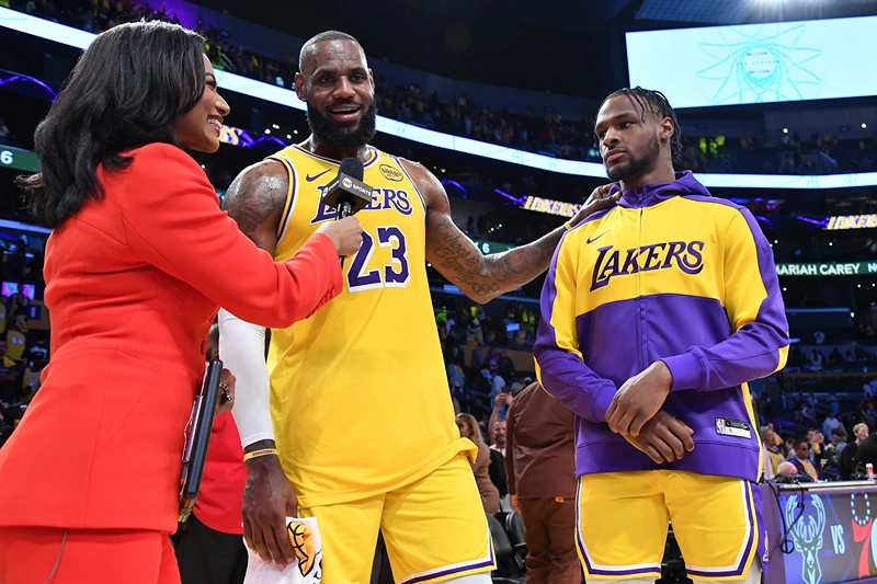 LOS ANGELES, CALIFORNIA - OCTOBER 22: LeBron James #23 and Bronny James #9 of the Los Angeles Lakers are interviewed after the game against the Minnesota Timberwolves at Crypto.com Arena on October 22, 2024 in Los Angeles, California. NOTE TO USER: User expressly acknowledges and agrees that, by downloading and or using this photograph, User is consenting to the terms and conditions of the Getty Images License Agreement. (Photo by Allen Berezovsky/Getty Images)