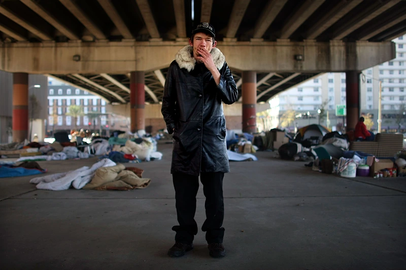 NEW ORLEANS - DECEMBER 16: Homeless man Jack Halterman stands beneath Interstate 10 where over 100 homeless people sleep each night December 16, 2007 in New Orleans, Louisiana. Affordable housing stocks have dwindled with rents rising 45 percent and homelessness has more than doubled to almost 12,000 individuals in New Orleans following Hurricane Katrina. (Photo by Mario Tama/Getty Images)