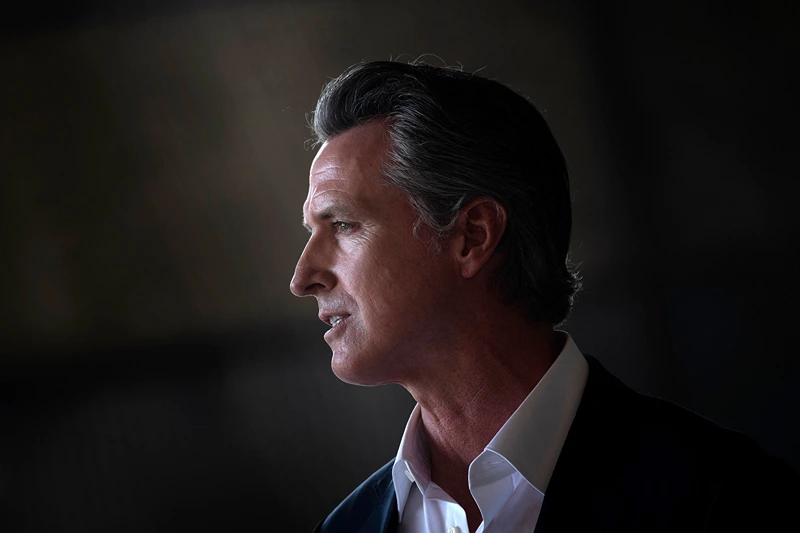 California Governor Gavin Newsom speaks as US President Joe Biden visits the state at Sacramento Mather Airport in Mather, California on September 13, 2021. - US President Joe Biden kicked off a visit to scorched western states Monday to hammer home his case on climate change and big public investments, as well as to campaign in California's recall election. (Photo by Brendan Smialowski / AFP) (Photo by BRENDAN SMIALOWSKI/AFP via Getty Images)