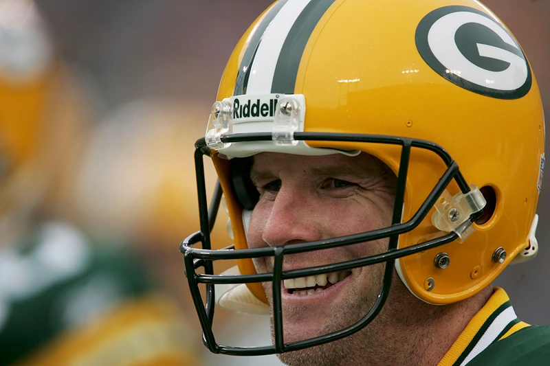 GREEN BAY, WI - JANUARY 1: Brett Favre #4 of the Green Bay Packers smiles as he walks off the field prior to the start of a game against the Seattle Seahawks January 1, 2006 at Lambeau Field in Green Bay, Wisconsin. (Photo by Jonathan Daniel/Getty Images)