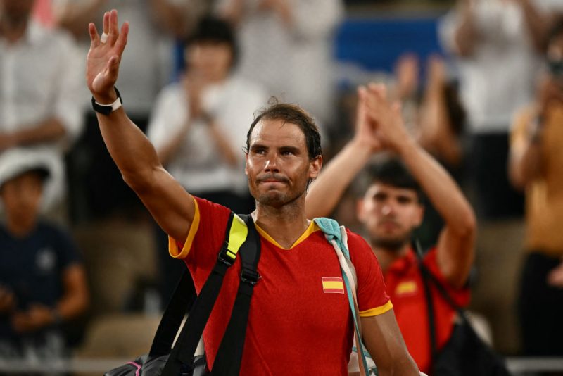 TOPSHOT - Spain's Rafael Nadal waves goodbye after he and Spain's Carlos Alcaraz lose to US' Austin Krajicek and US' Rajeev Ram in their men's doubles quarter-final tennis match on Court Philippe-Chatrier at the Roland-Garros Stadium during the Paris 2024 Olympic Games, in Paris on July 31, 2024. (Photo by CARL DE SOUZA / AFP) (Photo by CARL DE SOUZA/AFP via Getty Images)