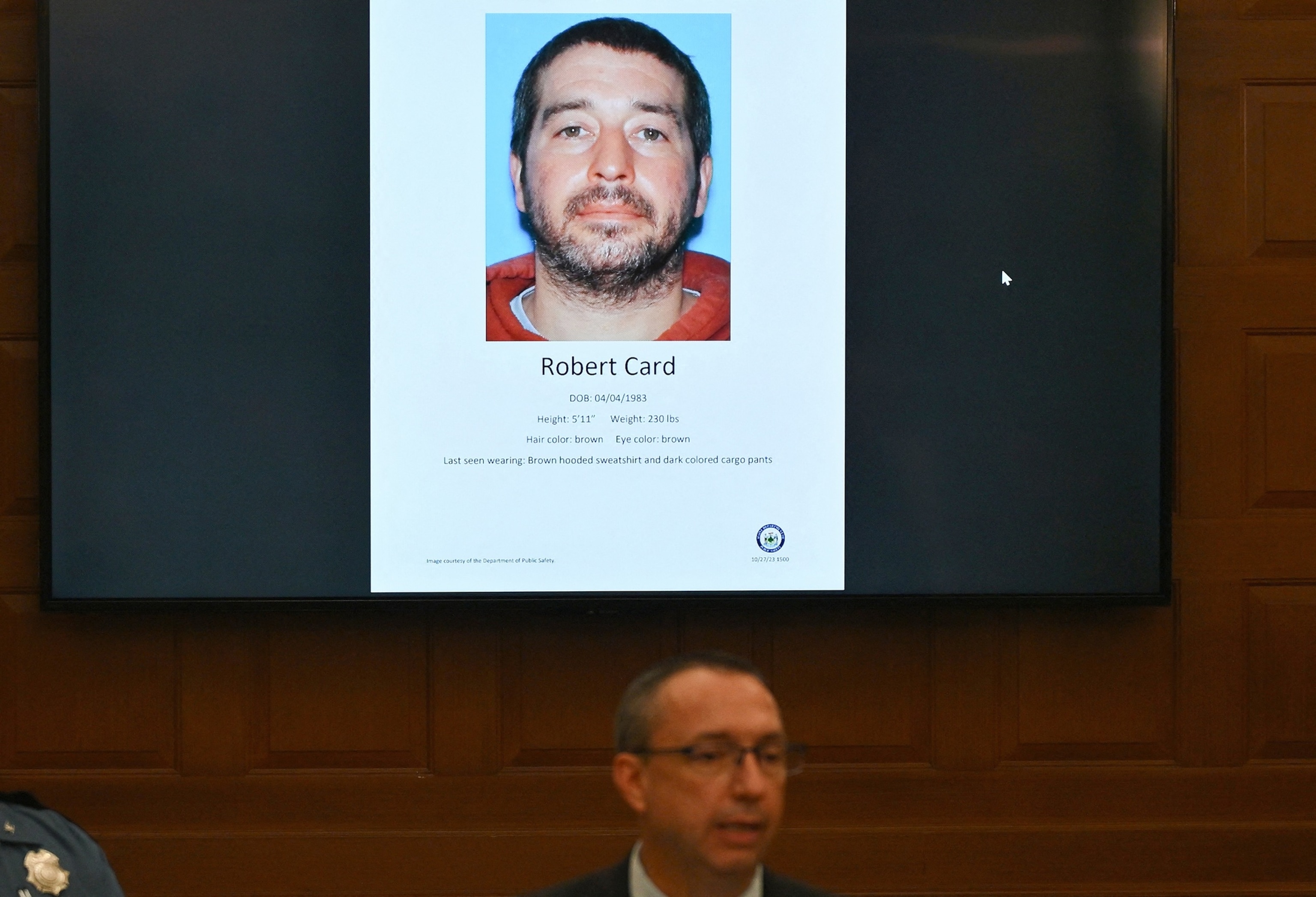 PHOTO: In this Oct. 27, 2023, file photo, Maine Department of Public Safety Commissioner Mike Sauschuck speaks during a press conference at Lewiston City Hall in Lewiston, Maine, under a picture of suspect Robert Card.