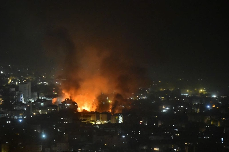 TOPSHOT - Smoke billows from the site of an Israeli airstrike that targeted a neighborhood in Beirut's southern suburb early on September 28, 2024. The Israeli army said September 28 that it killed the commander of Hezbollah's missile unit in southern Lebanon in an air strike, along with his deputy and several other leaders of the Iran-backed movement. Israeli fighter jets killed "Muhammad Ali Ismail, the commander of Hezbollah's missile unit in southern Lebanon, and his deputy," the military said in a statement on Telegram that added, "other Hezbollah commanders and terrorists were eliminated". (Photo by Fadel ITANI / AFP) (Photo by FADEL ITANI/AFP via Getty Images)