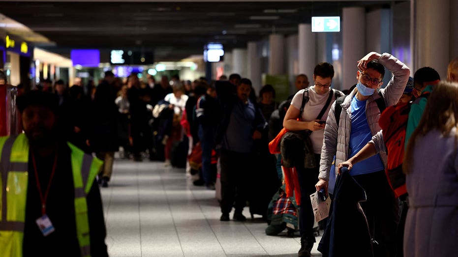 Passengers standing in line at Lufthansa airport