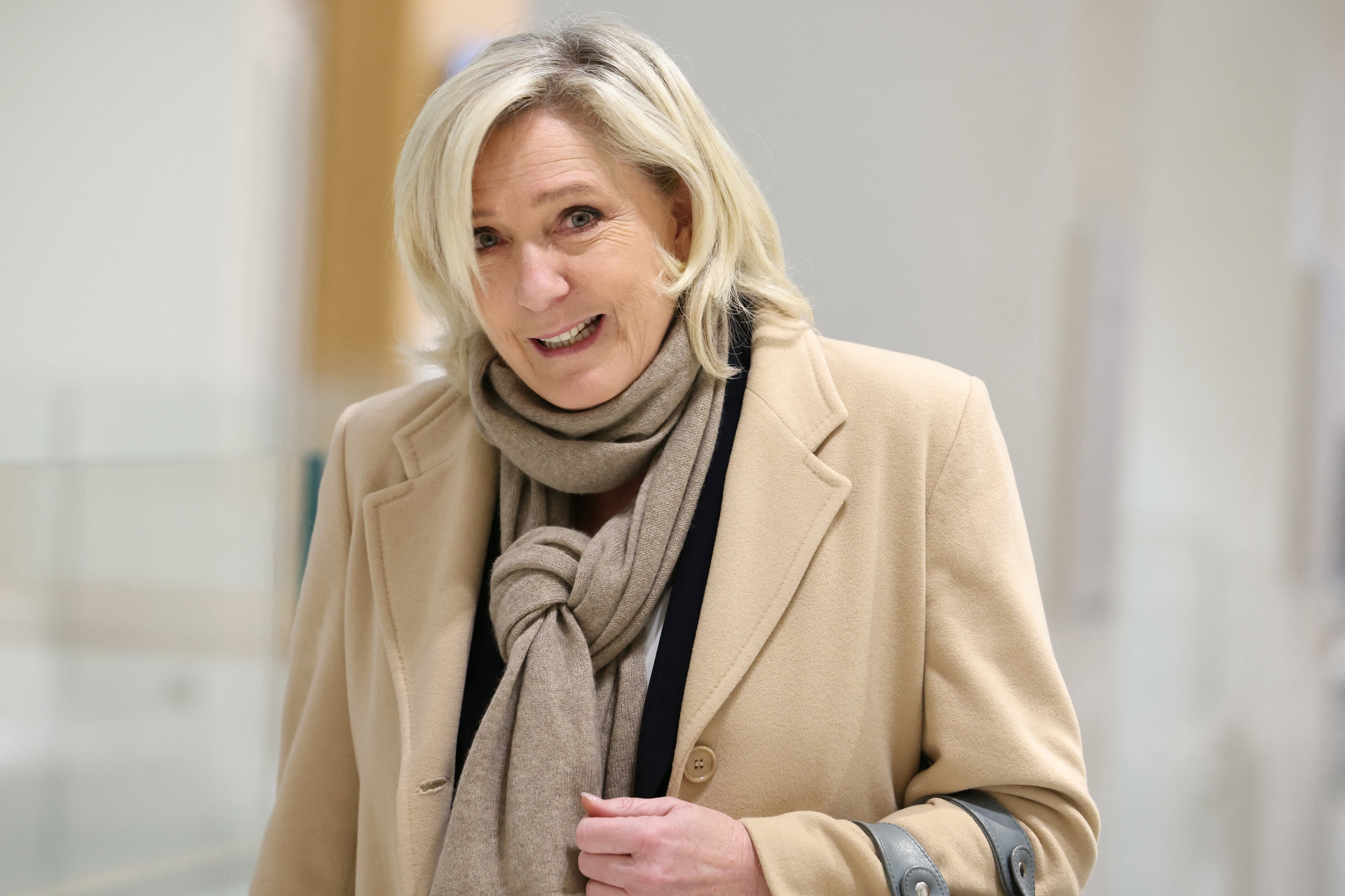 Member of French far-right party Rassemblement National (RN) Marine Le Pen walks at the Paris courthouse amid her trial on suspicion of embezzlement of European public funds, in Paris, on November 27, 2024. 