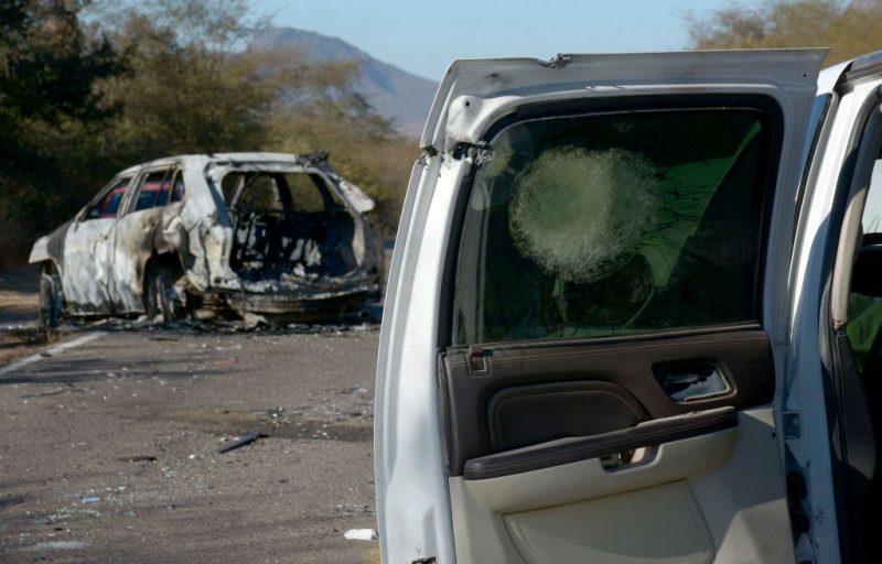 TOPSHOT - Cars burnt and destroyed during the operation to arrest Ovidio Guzman, aka "El Raton" (The Mouse), son of jailed drug trafficker Joaquin "El Chapo" Guzman, are seen in the Jesus Maria area in Culiacan, Sinaloa State, Mexico, on January 7, 2023, where Ovidio Guzman was arrested on January 5. - Ten soldiers and 19 suspected criminals were killed in an operation to arrest Ovidio Guzman, with a dramatic shootout sowing terror at an airport. Thousands of soldiers retook control of the Sinaloa cartel stronghold of Culiacan, which resembled a war zone after furious gunmen went on the rampage to try to free their boss. Guzman was captured and flown to Mexico City before being transferred to the high-security Altiplano prison in central Mexico from which "El Chapo" once escaped. (Photo by JUAN CARLOS CRUZ / AFP) (Photo by JUAN CARLOS CRUZ/AFP via Getty Images)