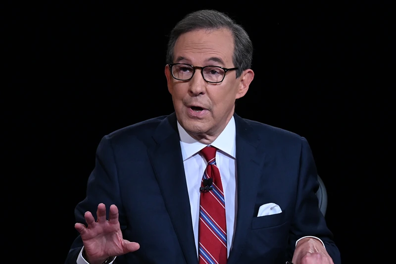 Debate moderator and Fox News anchor Chris Wallace directs the first presidential debate between U.S. President Donald Trump and Democratic presidential nominee Joe Biden at the Health Education Campus of Case Western Reserve University on September 29, 2020 in Cleveland, Ohio. This is the first of three planned debates between the two candidates in the lead up to the election on November 3. (Photo by Olivier Douliery-Pool/Getty Images)