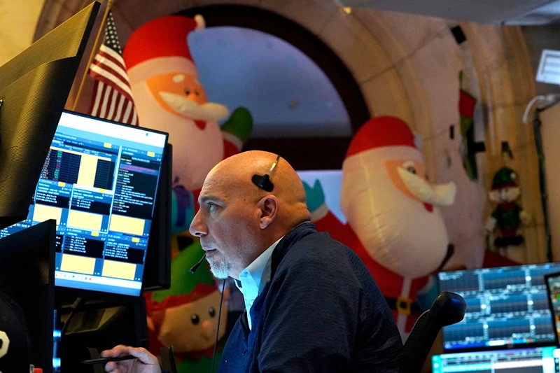 A trader works on the floor of the New York Stock Exchange (NYSE) at the opening bell on November 26, 2024, in New York City. (Photo by TIMOTHY A. CLARY / AFP) (Photo by TIMOTHY A. CLARY/AFP via Getty Images)