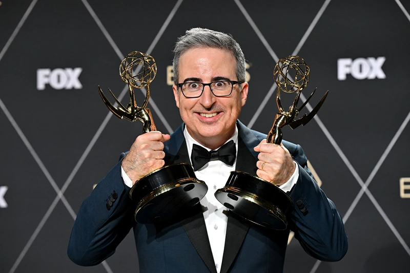 TOPSHOT - John Oliver, winner of Outstanding Scripted Variety and Outstanding Writing for a Variety Series "Last Week Tonight with John Oliver" poses in the press room during the 75th Emmy Awards at the Peacock Theatre at L.A. Live in Los Angeles on January 15, 2024. (Photo by Robyn BECK / AFP) (Photo by ROBYN BECK/AFP via Getty Images)