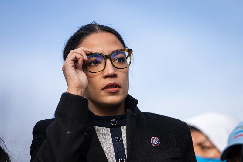 WASHINGTON, DC - DECEMBER 7: Rep. Alexandria Ocasio-Cortez (D-NY) prepares to speak during a rally for immigration provisions to be included in the Build Back Better Act outside the U.S. Capitol December 7, 2021 in Washington, DC. Progressive Democrats are urging the Senate to include a pathway to citizenship for undocumented immigrants living in the U.S. in the Build Back Better Act. (Photo by Drew Angerer/Getty Images)