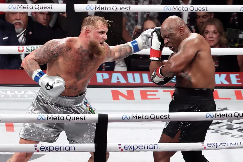 Mike Tyson (black gloves) fights Jake Paul (silver gloves) at AT&T Stadium. Kevin Jairaj-Imagn Images/File Photo