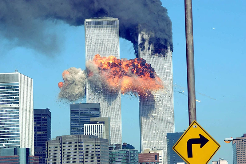 394261 14: A fiery blasts rocks the World Trade Center after being hit by two planes September 11, 2001 in New York City. (Photo by Spencer Platt/Getty Images)