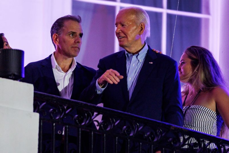 WASHINGTON, DC - JULY 04: President Joe Biden talks to his son, Hunter Biden, following the fireworks on the National Mall with First Lady Jill Biden and Second Gentleman Doug Emhoff from the White House balcony during a 4th of July event on the South Lawn of the White House on July 4, 2024 in Washington, DC. The President is hosting the Independence Day event for members of the military and their families. (Photo by Samuel Corum/Getty Images)