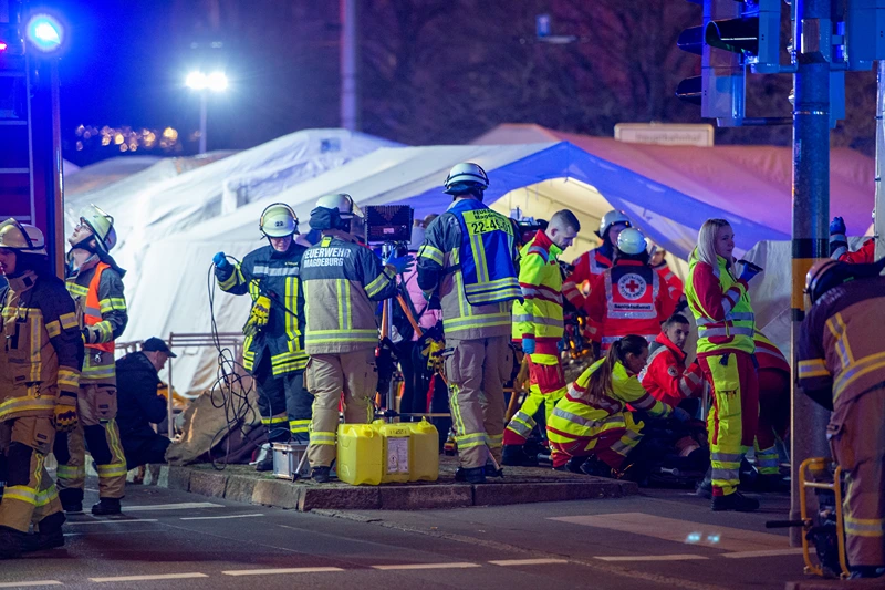 MAGDEBURG, GERMANY - DECEMBER 20: Police vans and ambulances stand next to the annual Christmas market in the city center following a possible terror incident on December 20, 2024 in Magdeburg, Germany. According to initial reports at least one person is dead and dozens injured after a car drove into the crowded Christmas market. Police reportedly arrested the driver. (Photo by Craig Stennett/Getty Images)