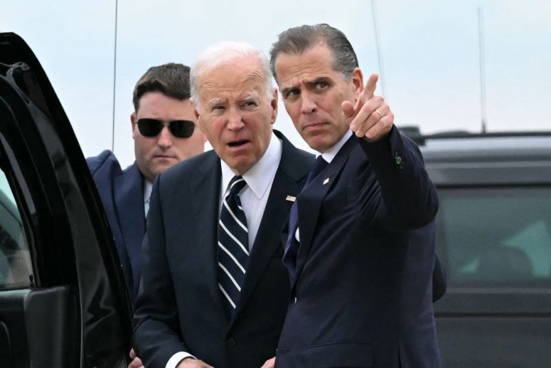 TOPSHOT - US President Joe Biden talks with his son Hunter Biden upon arrival at Delaware Air National Guard Base in New Castle, Delaware, on June 11, 2024, as he travels to Wilmington, Delaware. A jury found Hunter Biden guilty on June 11 on federal gun charges in a historic first criminal prosecution of the child of a sitting US president. The 54-year-old son of President Joe Biden was convicted on all three of the federal charges facing him, CNN and other US media reported. (Photo by ANDREW CABALLERO-REYNOLDS / AFP) (Photo by ANDREW CABALLERO-REYNOLDS/AFP via Getty Images)