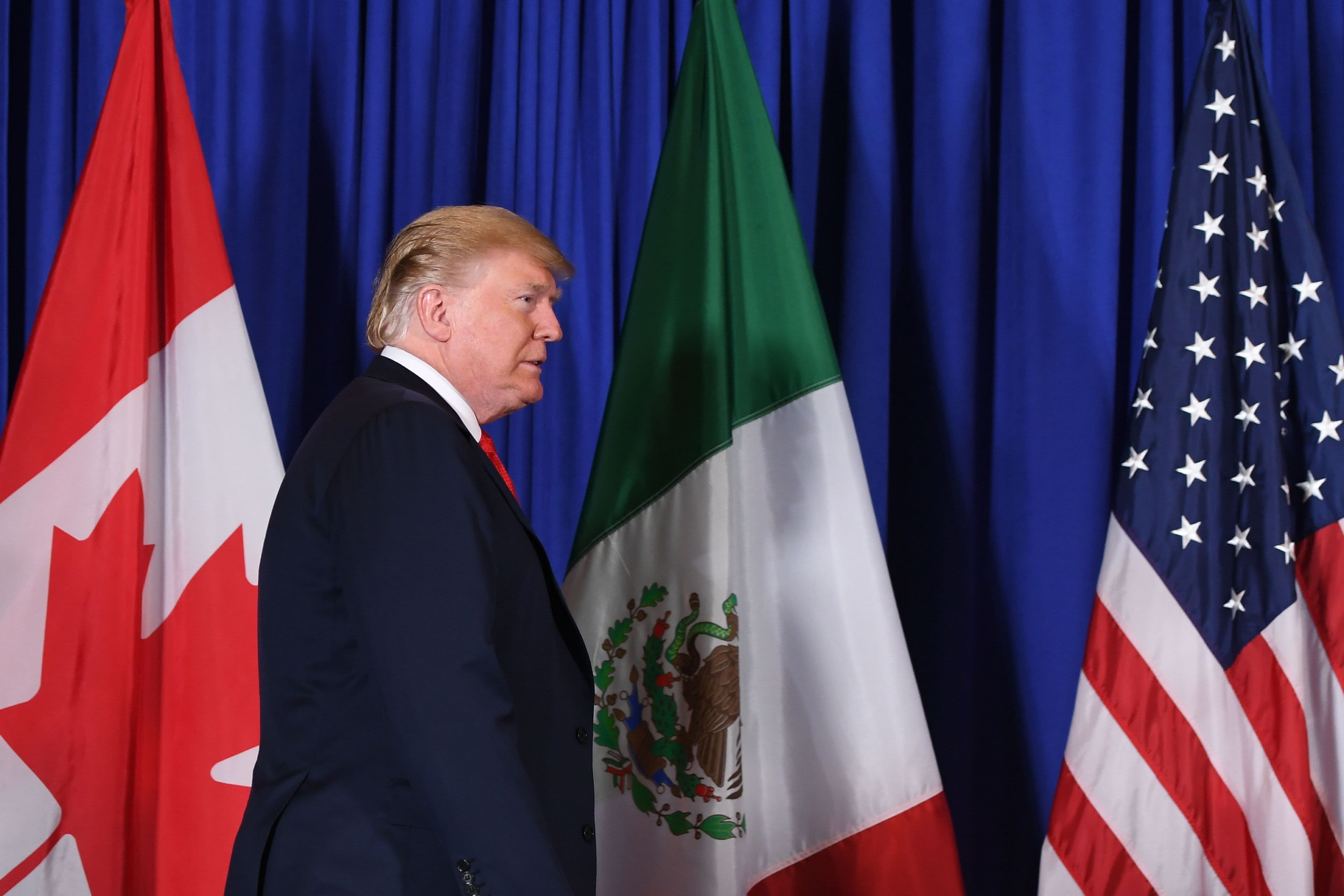 US President Donald Trump arrives to deliver a statement along with Mexican President Enrique Pena Nieto and Canadian Prime Minister Justin Trudeau, on the signing of a new free trade agreement in Buenos Aires, on November 30, 2018, on the sidelines of the G20 Leaders' Summit.