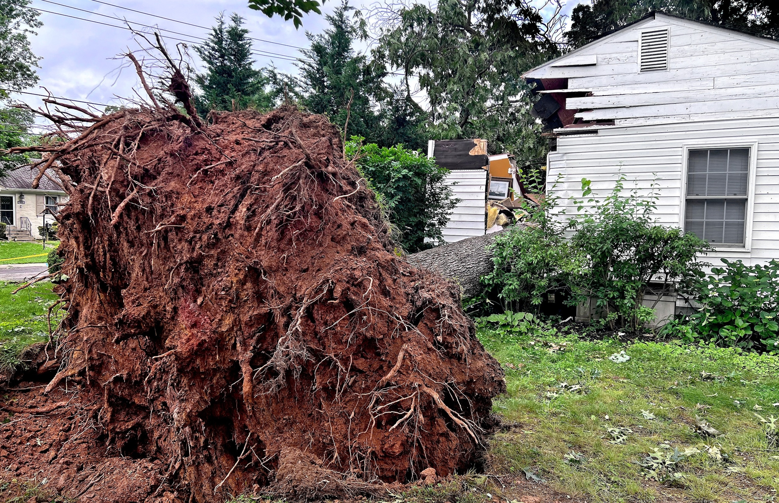 PHOTO: In this June 6, 2024, file photo a badly damaged home can be seen on Dogwood Drive in Gaithersburg, Maryland, after the home was hit by a fallen tree. 